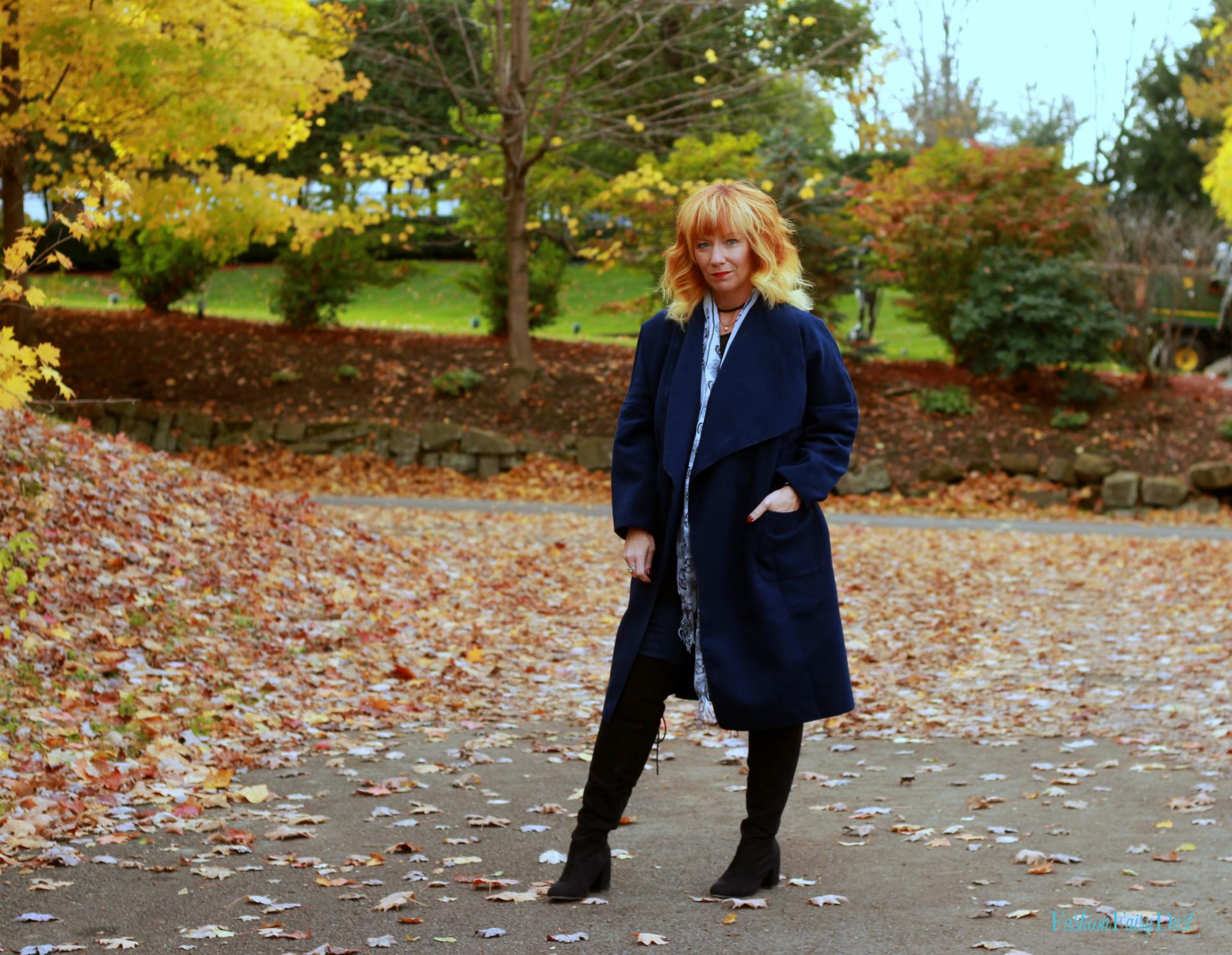 Blue drape front coat, black over the knee boots and skinny jeans. How to mix navy blue and black.