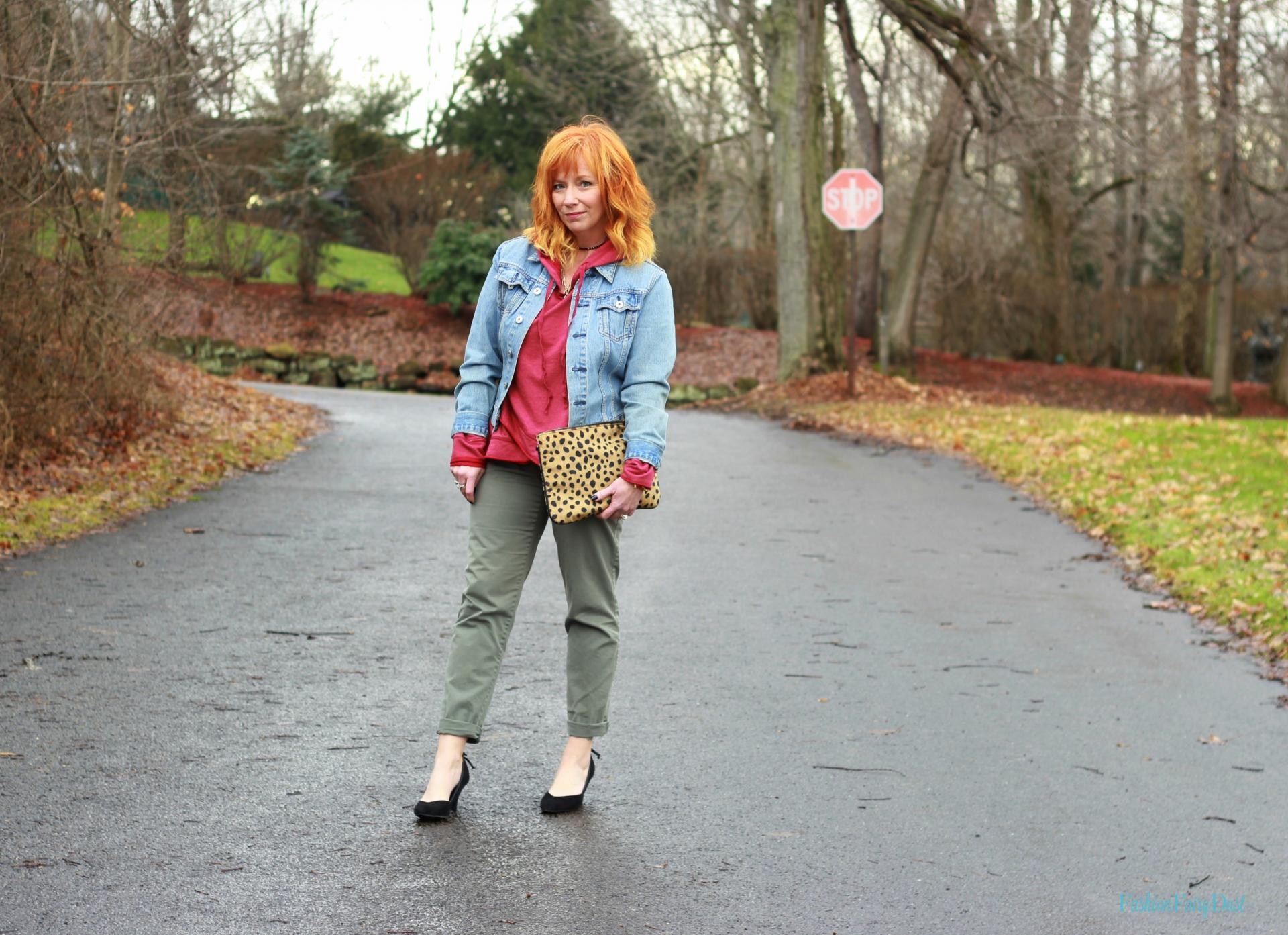 Red hooded sweatshirt, khakis and black pumps. How to style a sweatshirt for everyday wear.