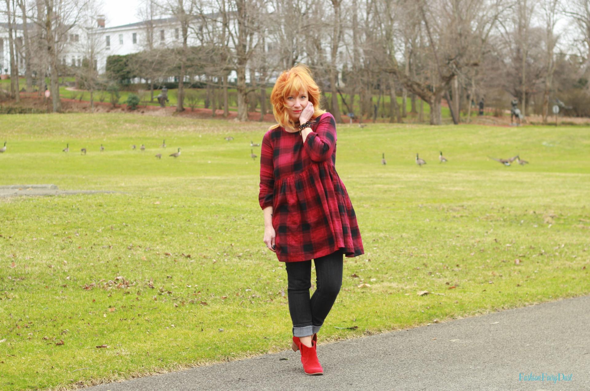 Buffalo plaid tunic, black skinny jeans and red ankle boots. Casual style.