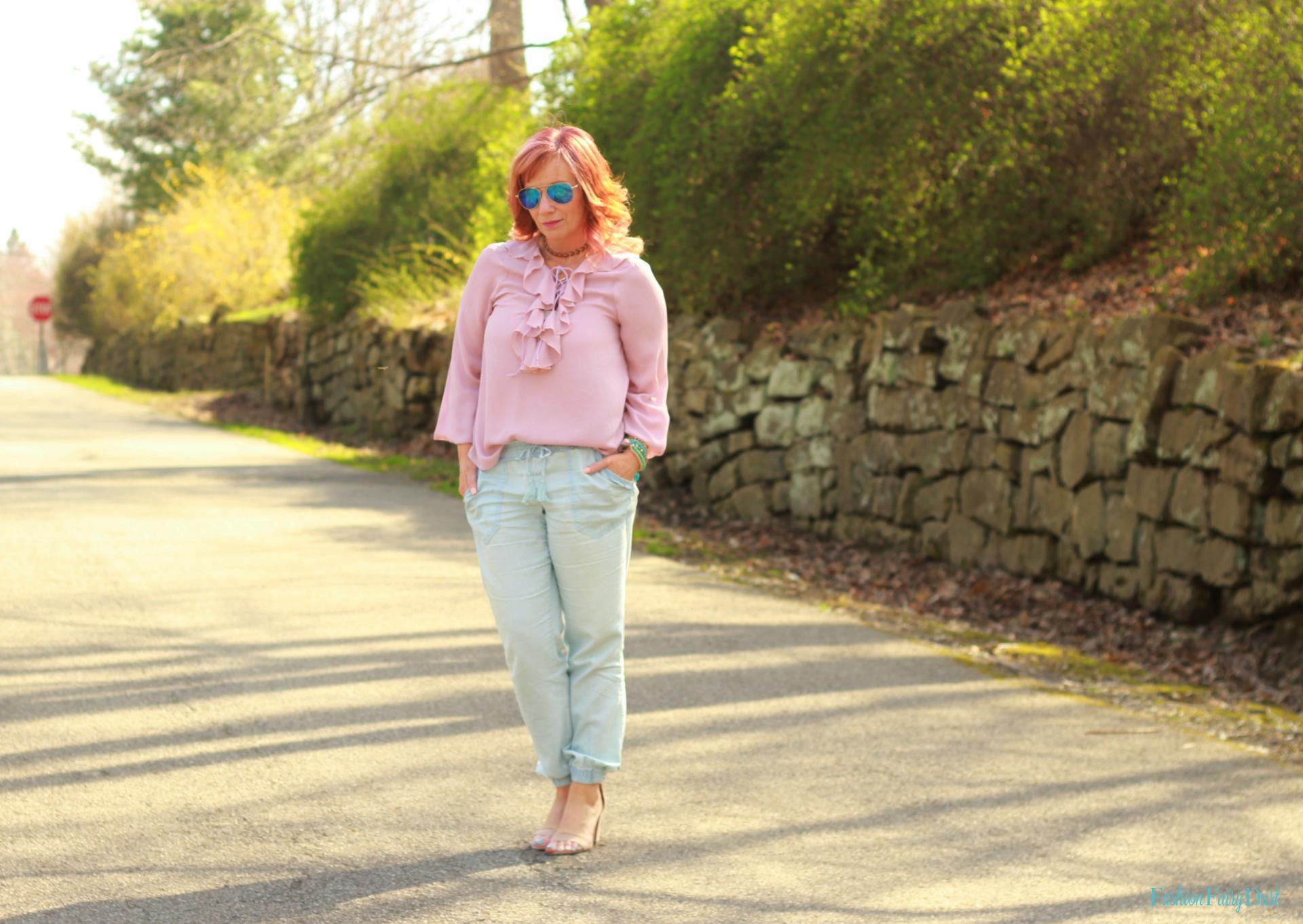 Pink ruffled top, chambray pants and nude block heel sandals.