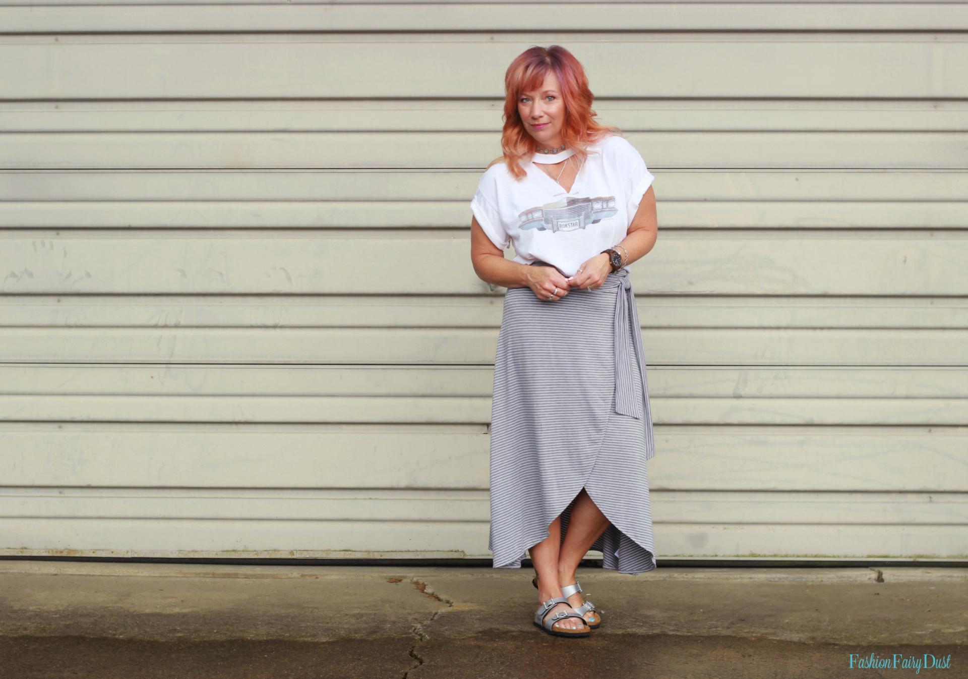 Wrap midi skirt, concert tee shirt, and Birkenstocks.