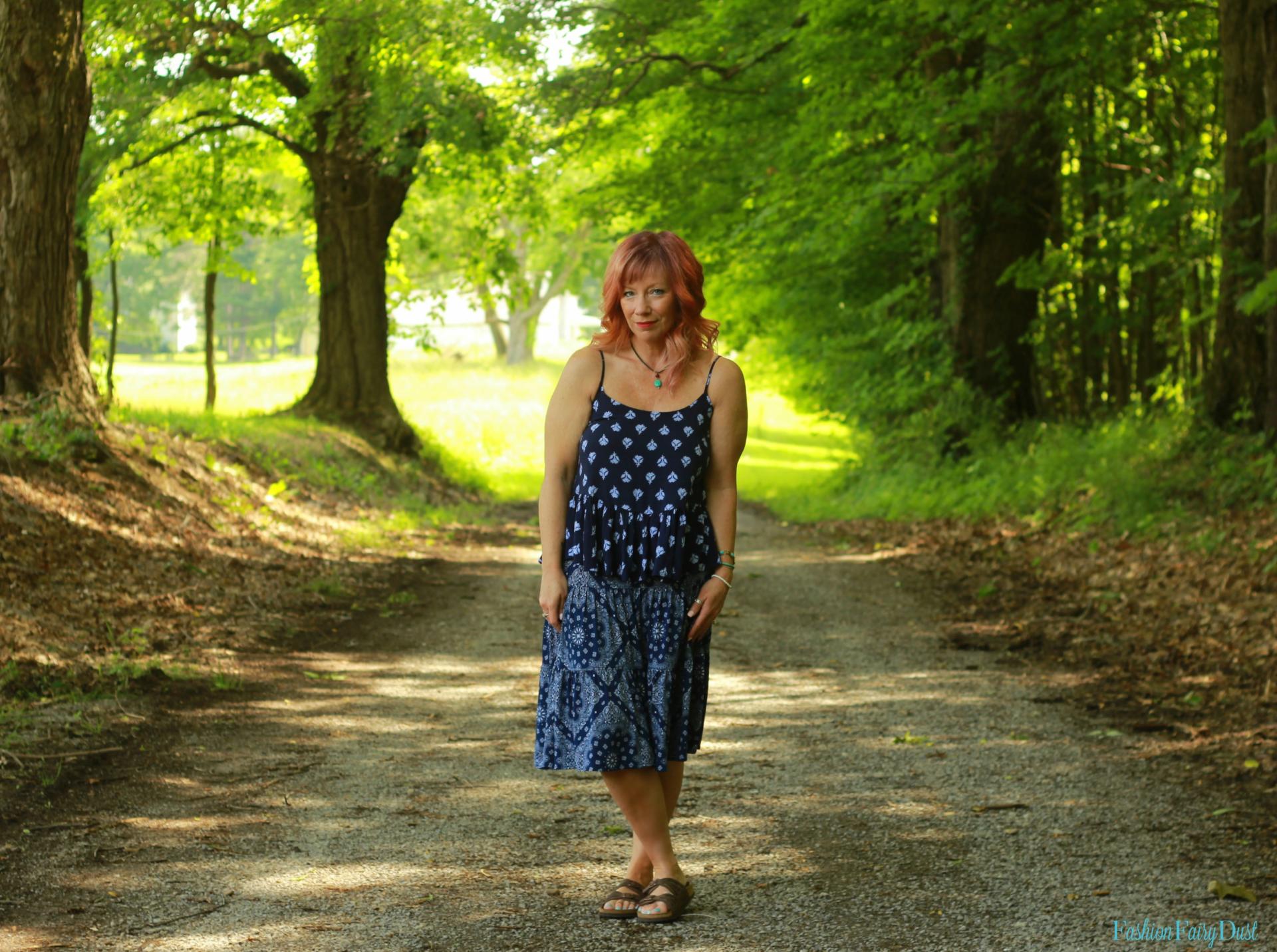 Bandana print skirt, peplum tank top and basket weave clutch.