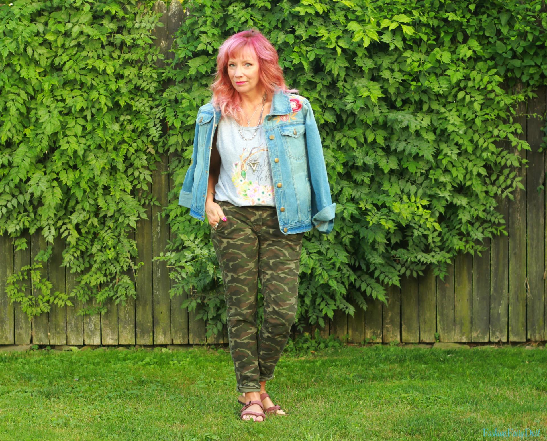 Camo pants, embroidered denim jacket and graphic tank top.