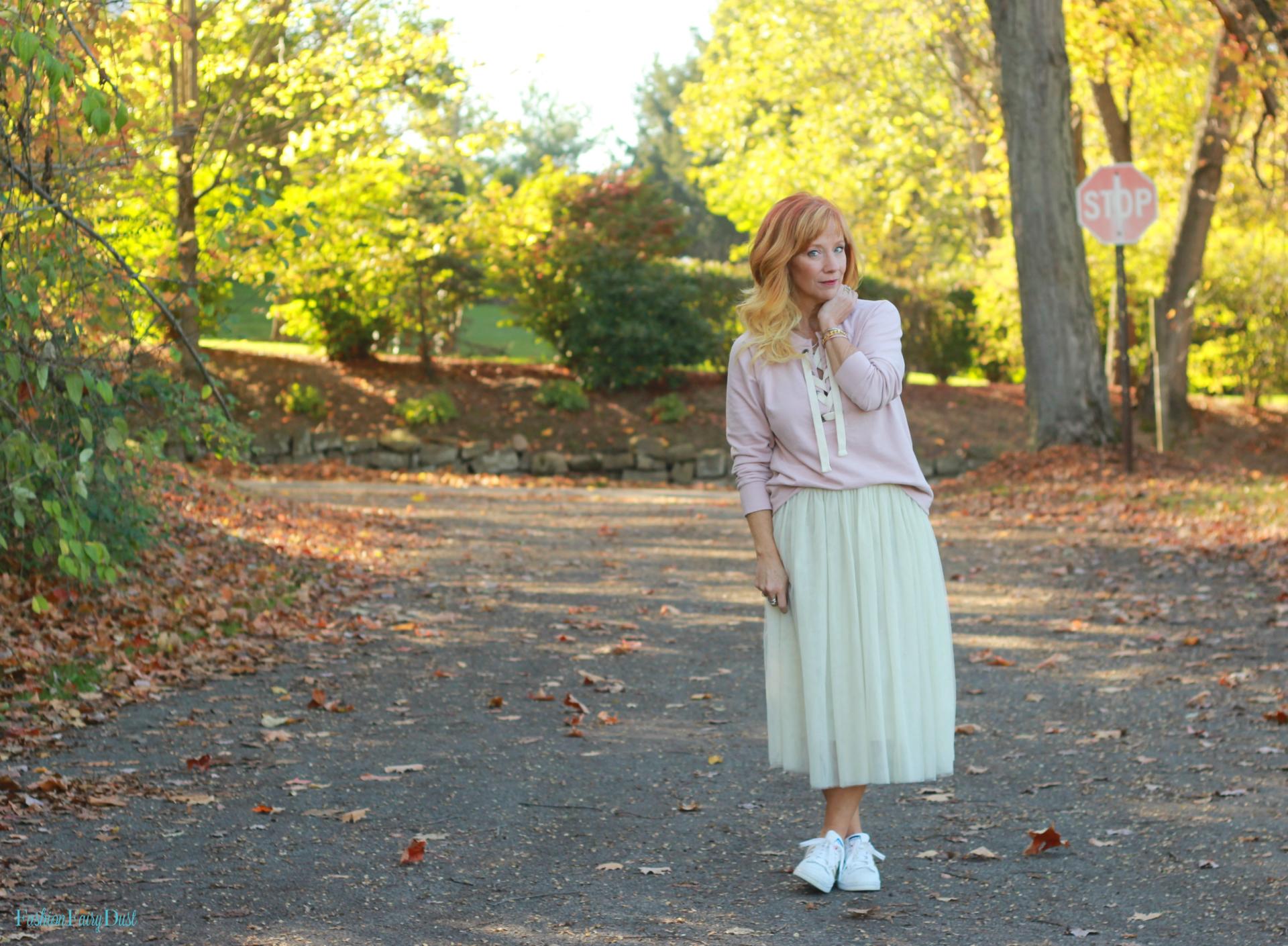 Pink lace up sweatshirt, tulle skirt and Adidas.