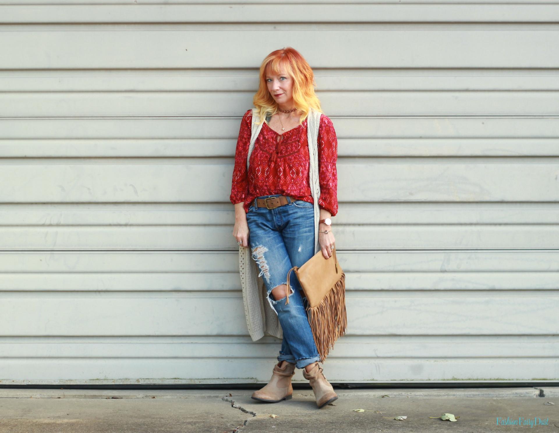 Boho top, boyfriend jeans, Birkenstock boots and fringe clutch.