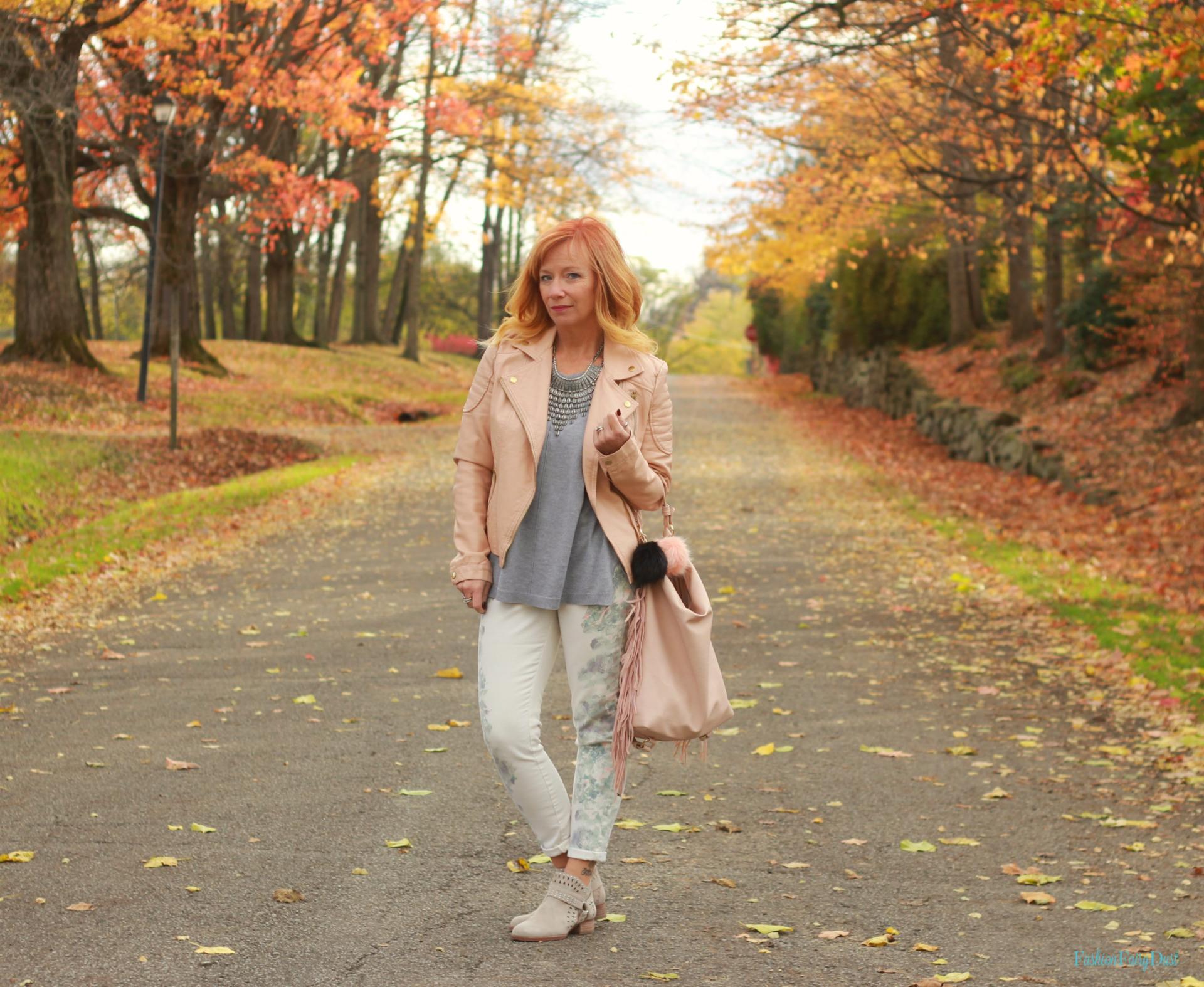 Floral print jeans, pink moto jacket & gray sweater.