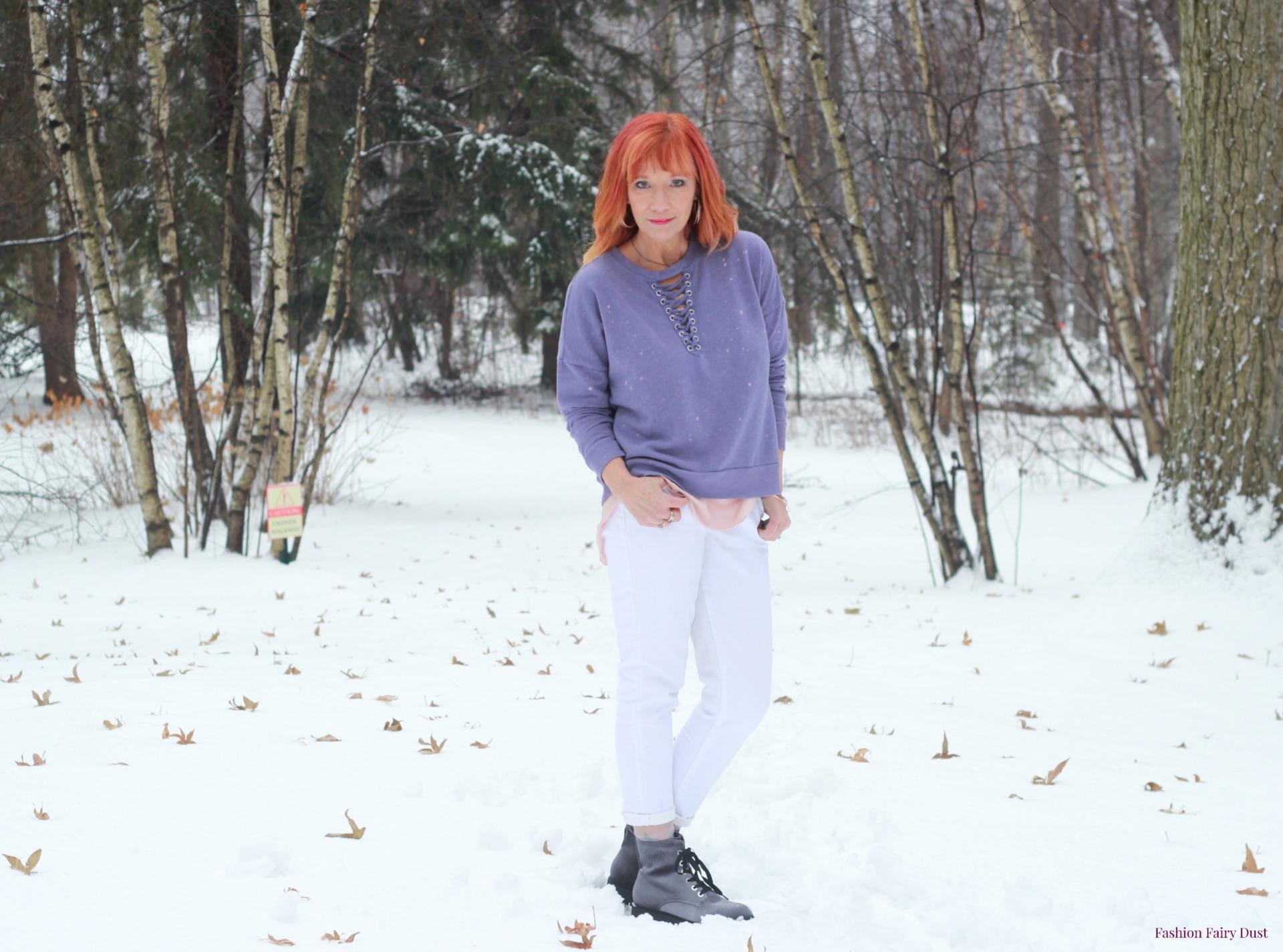 Velvet combat boots, purple lace up sweatshirt and white jeans.