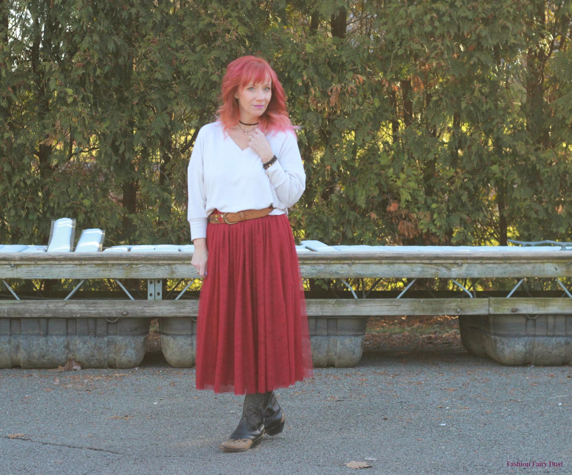 Burgundy tulle skirt, cowboy boots and sweatshirt.
