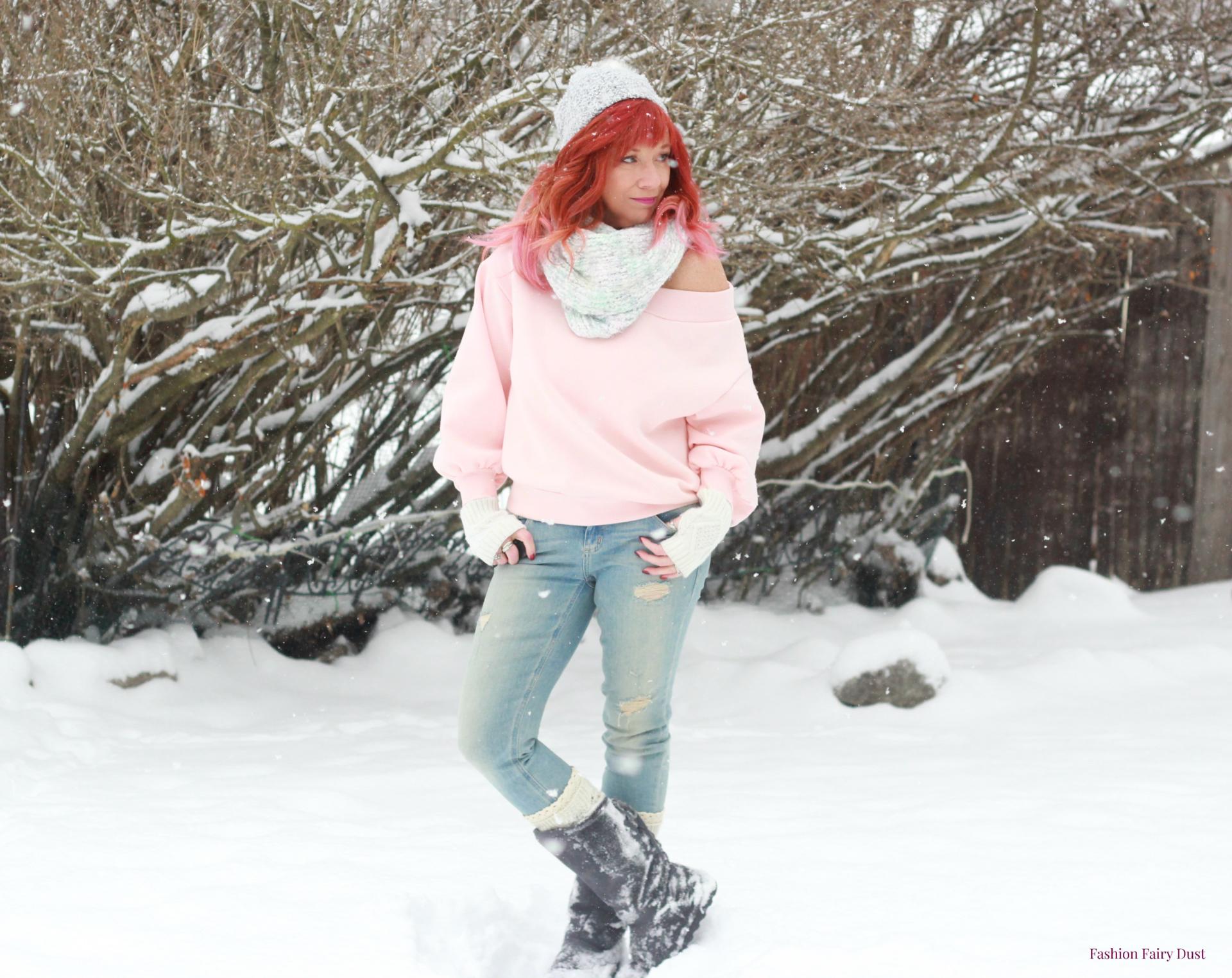 Pink off the shoulder sweatshirt, Bearpaw Boots and skinny jeans.