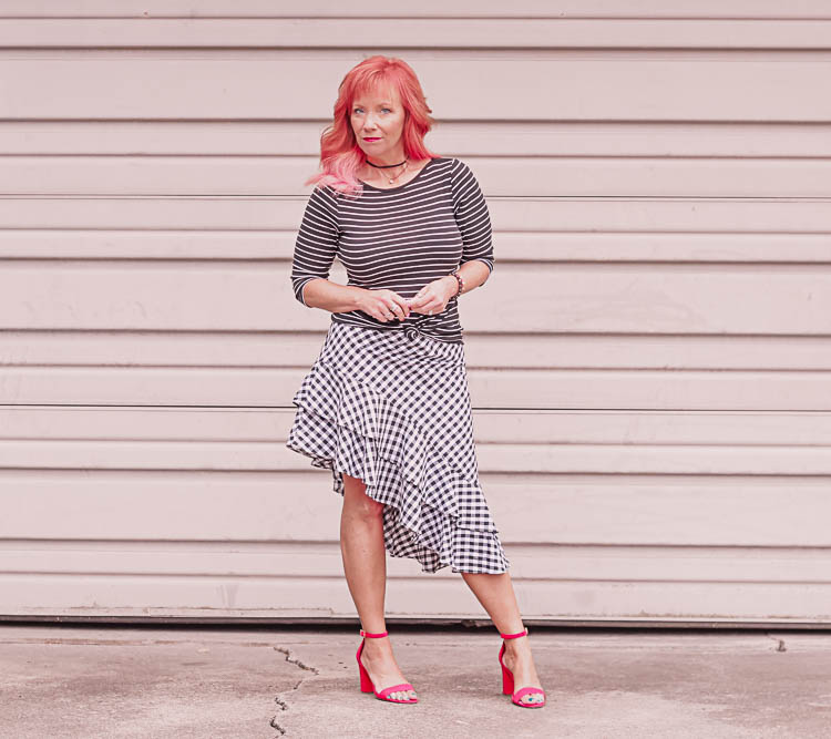 Gingham skirt, striped top and red sandals.